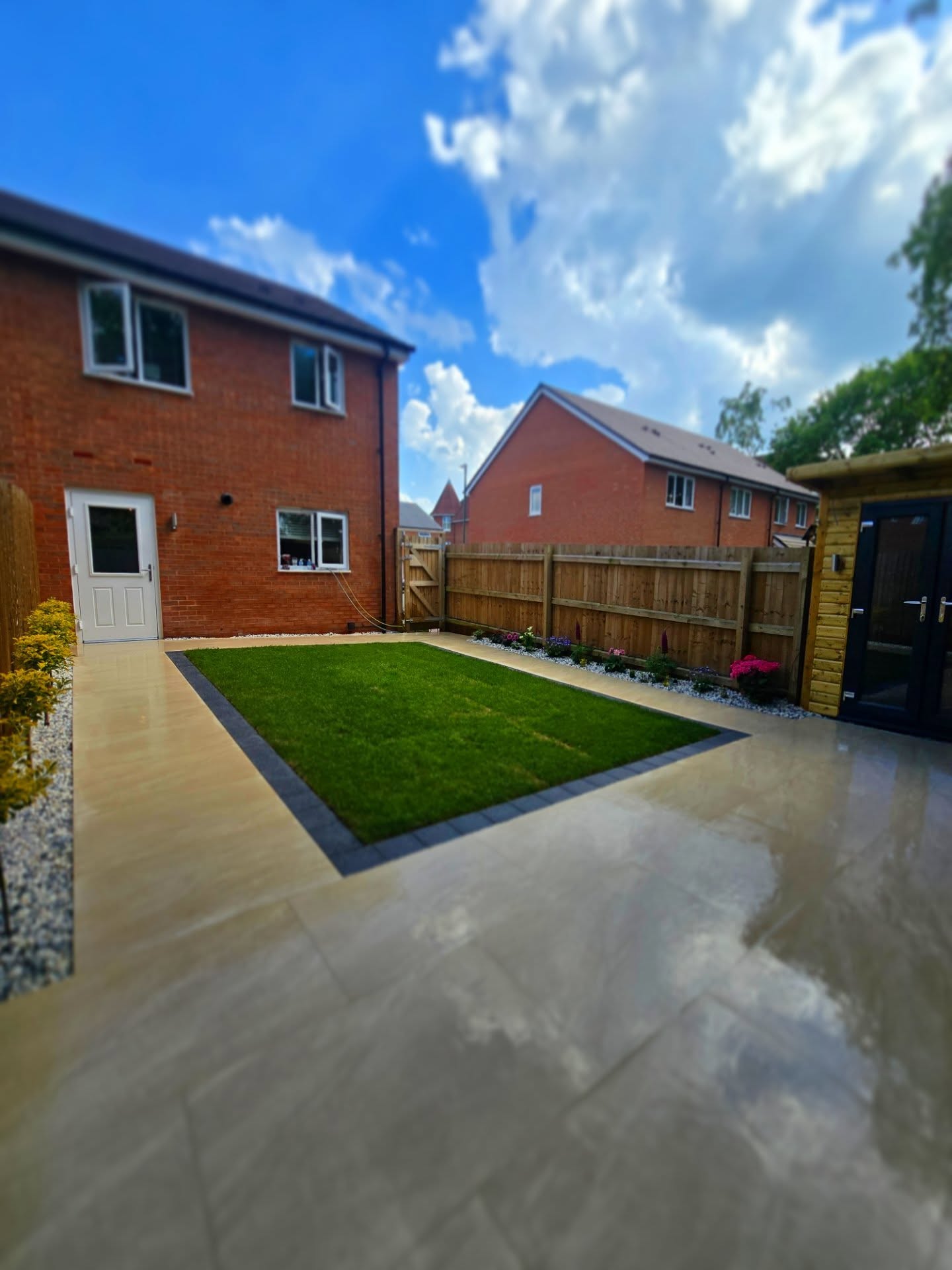 Finished patio and central lawn viewed towards the house