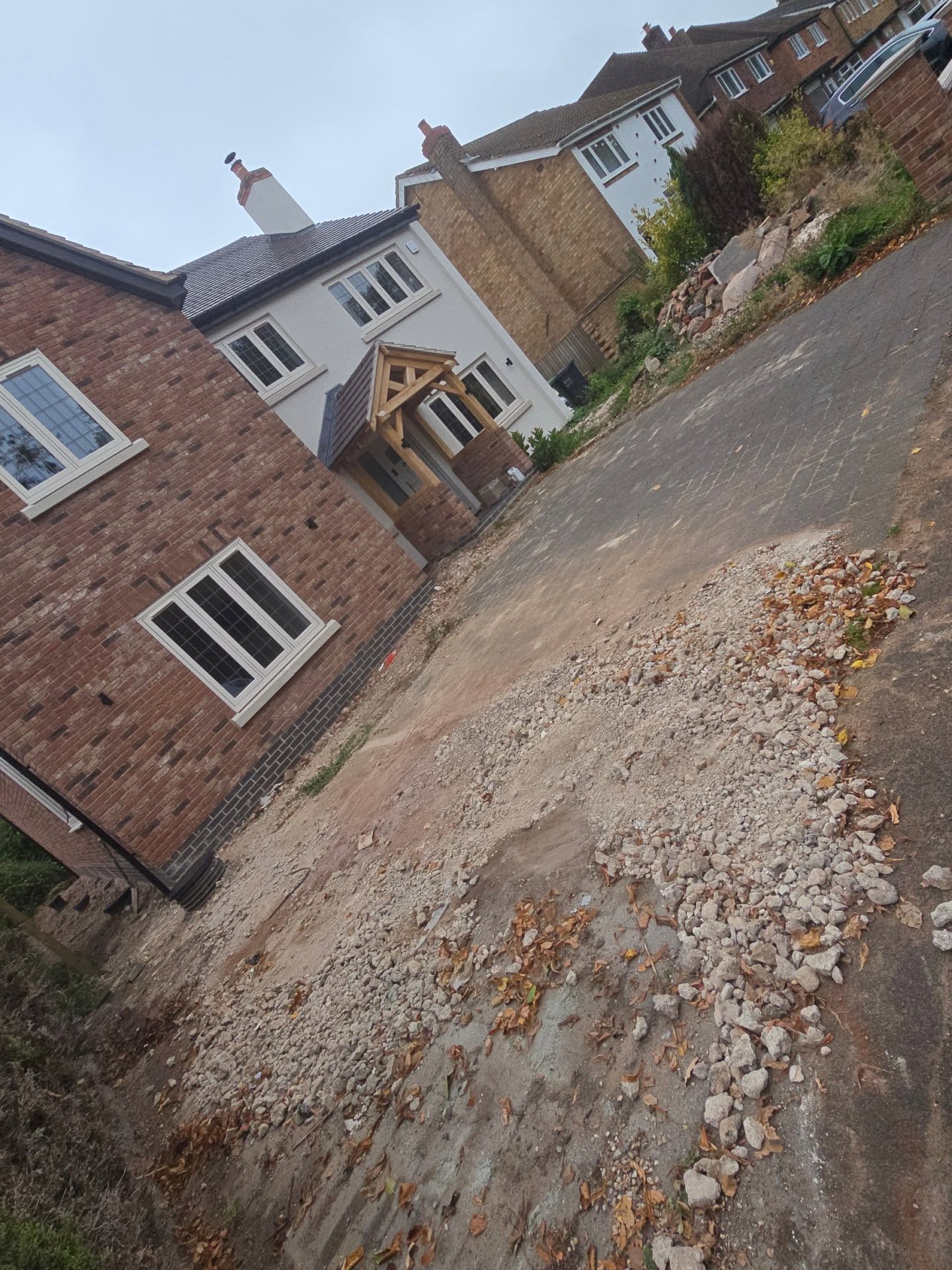 The frontage before work began, with loose rubble and bare ground