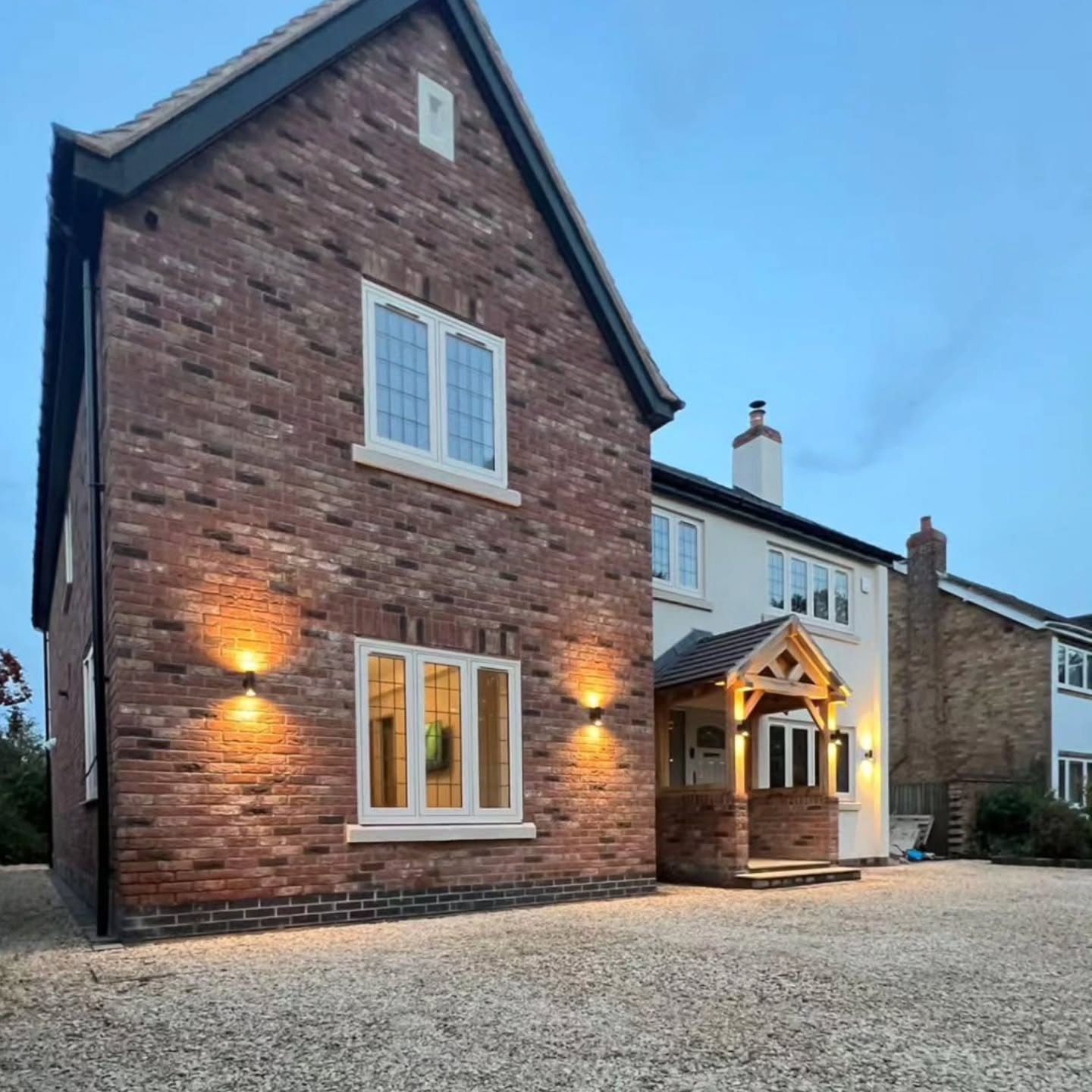 Gravel frontage and porch area photographed in the evening